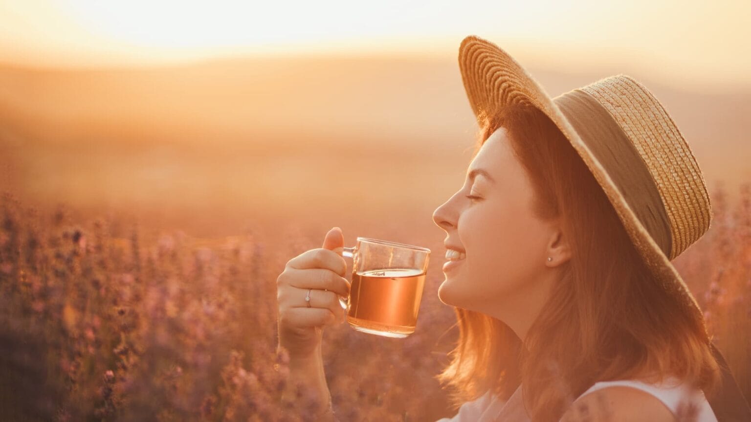 young happy woman drinking herbal tea sitting in 2024 12 05 00 31 51 utc