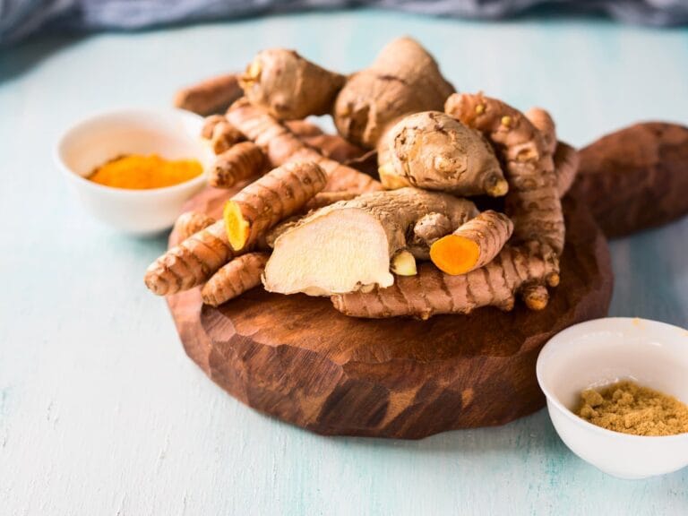 turmeric and ginger in powder and roots on board 2025 03 24 04 59 01 utc