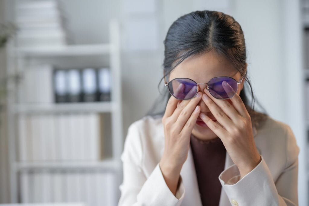 young businesswoman is rubbing her tired eyes suf 2025 03 08 23 24 49 utc