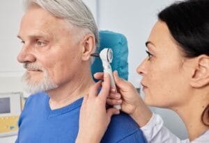 otolaryngologist doctor checking senior man s ear 2025 04 01 20 38 47 utc